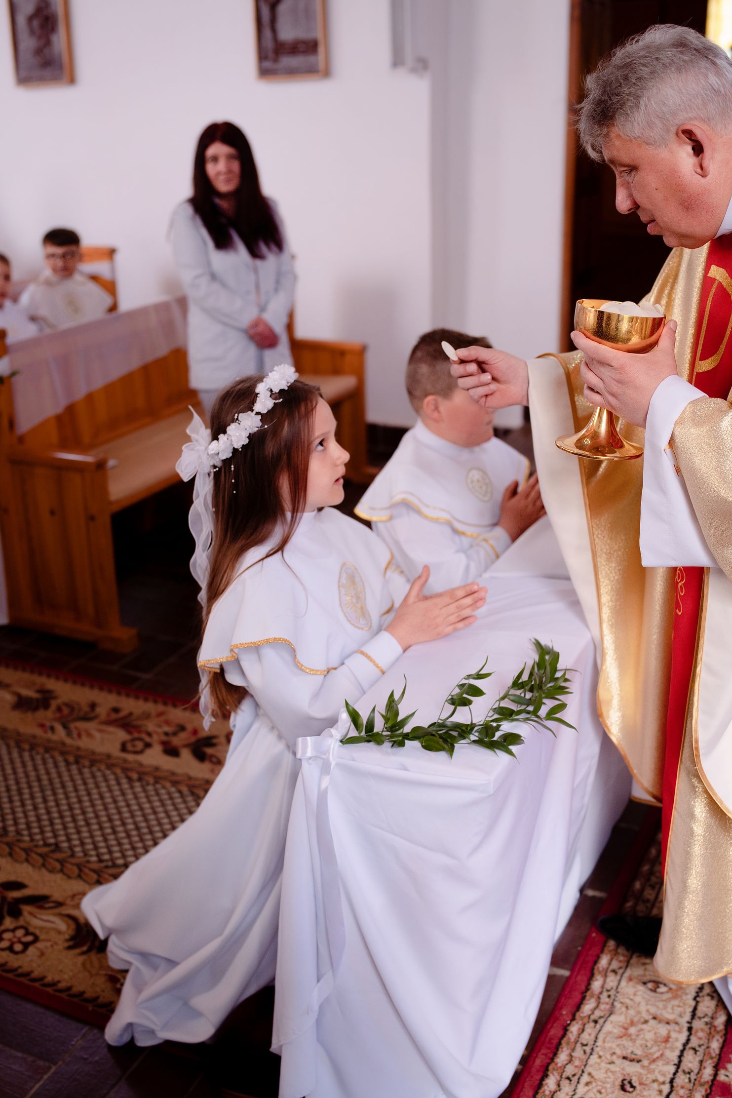 Przyjęcie Pierwszej Komunii Świętej przez dziecko